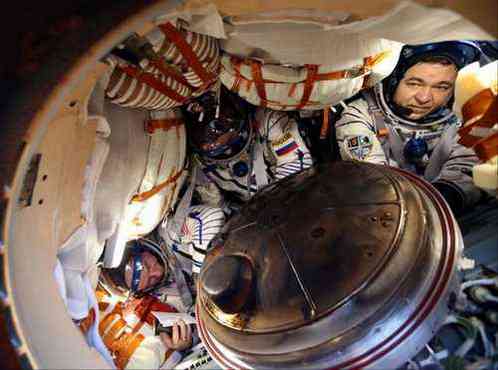 NASA astronaut Jeff Williams, left, Russian cosmonauts Alexey Ovchinin, center, and Oleg Skripochka of Roscosmos are seen inside the Soyuz TMA-20M spacecraft a few moments after they landed in a remote area near the town of Zhezkazgan, Kazakhstan, Wednesday, Sept. 7, 2016. The record-setting American and two Russians landed safely back on Earth Wednesday after a six-month mission aboard the International Space Station. (Maxim Shipenkov/Pool Photo via AP)